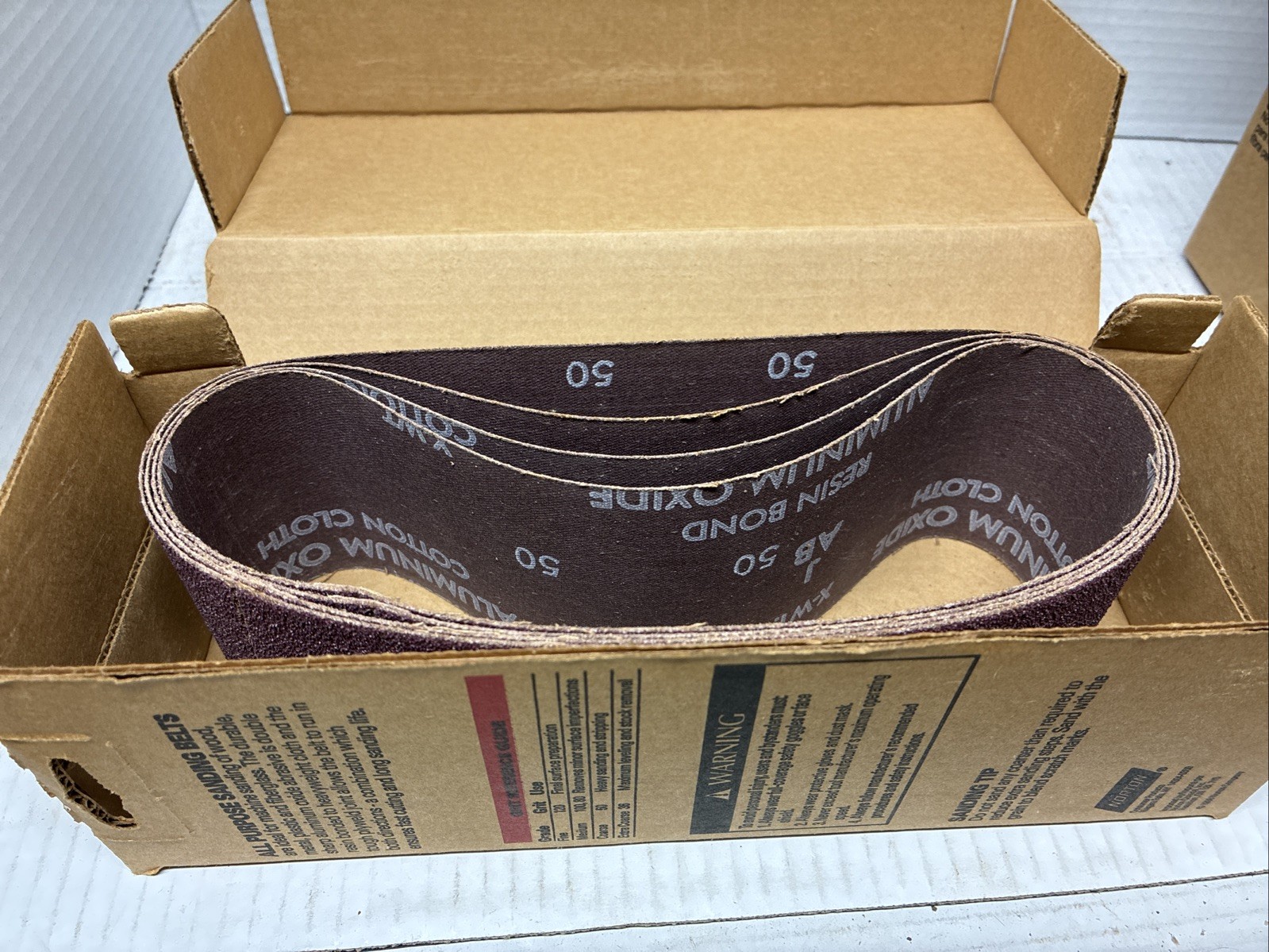 Lot Of 4 Boxes Of 3″ X 21″ Aluminum Oxide Belt Open Boxes See Description